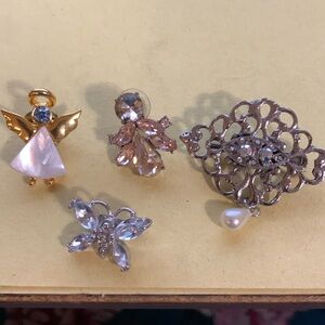 Three pins and a brooch